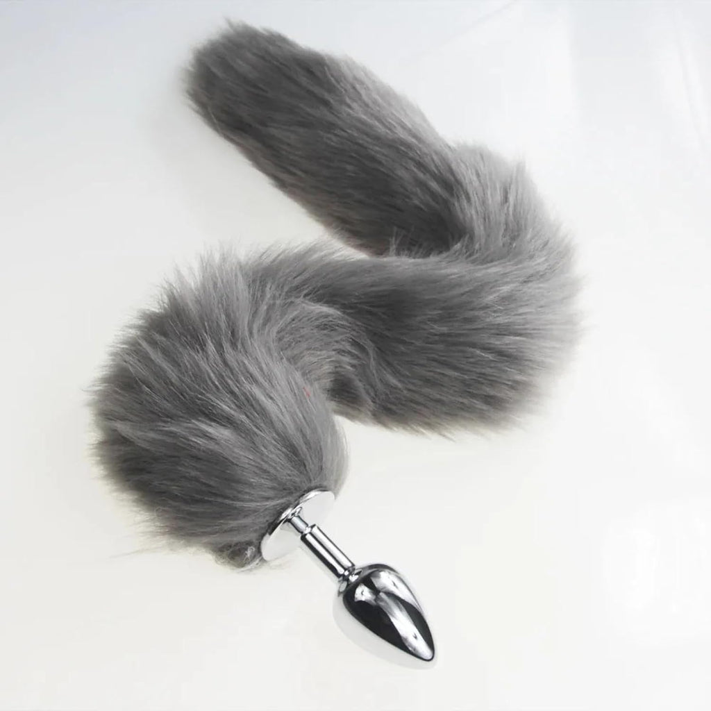 Grey, pink, and black fox tail plug with anal insert from E-12, E-13, E-11 collection, featuring a realistic furry fox tail.