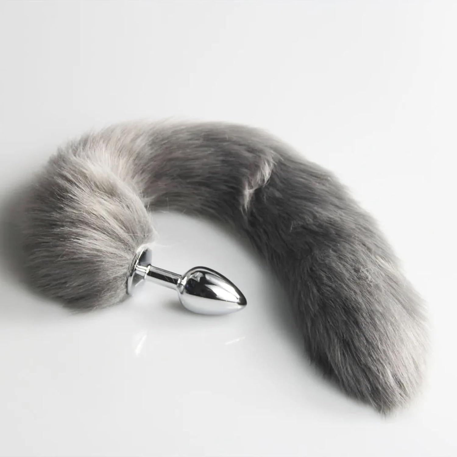 Silicone fox tail plug in grey, pink, and black with a realistic fox tail, designed for anal pleasure by E-12, E-13, E-11.