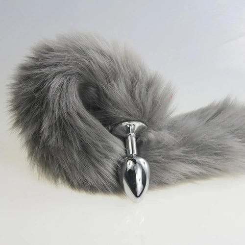 Grey, pink, and black fox tail plug by E-12, E-13, E-11 featuring a realistic fox tail attached to a smooth anal plug.