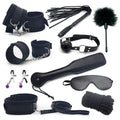 Couple wearing black leather BDSM bondage set with restraints and harnesses for adult BDSM play by D-21.