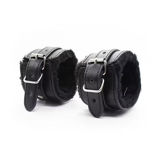 Couple wearing D-21 BDSM Dominus Noir leather bondage set with straps and restraints for adult BDSM play.